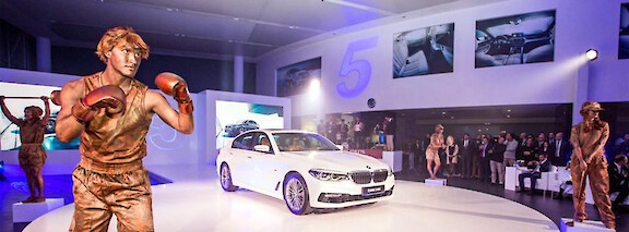 sport themed human statues